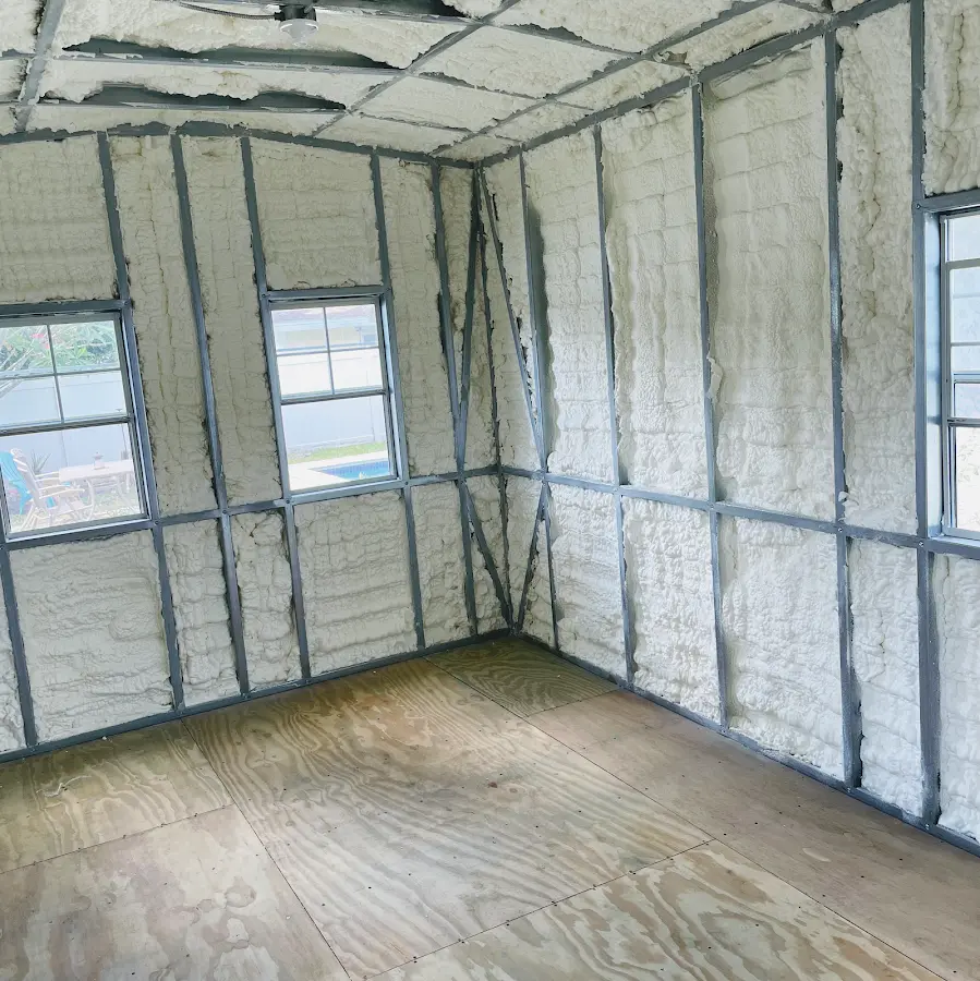 Closed-cell spray foam insulation applied to wall cavities in a residential project in Beatrice